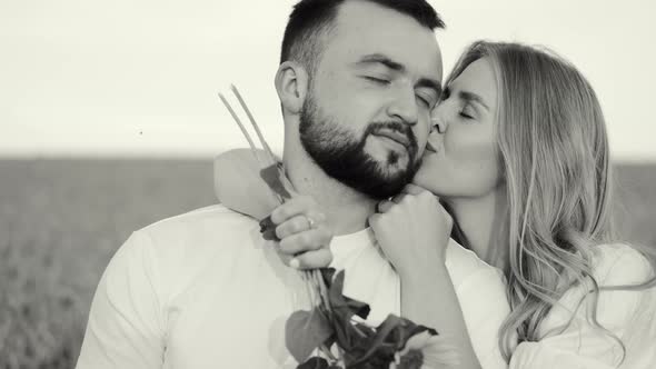 Young Beautiful Couple in a Wheat Field in Black and White Filter alt