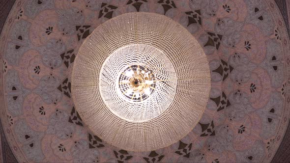 The ceiling is in a traditional oriental style with many details
