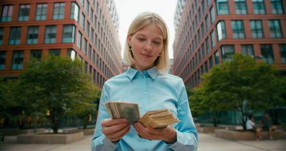 Beautiful Girl Manager Counts a Wad of Cash alt