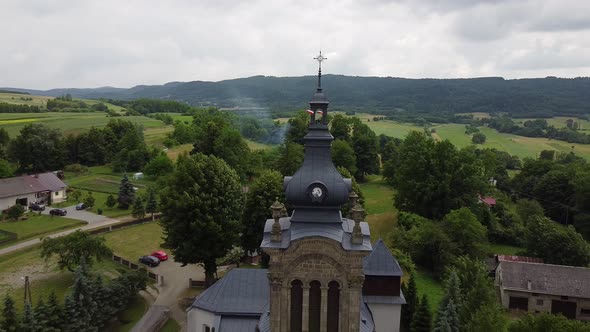 Drone View of Small Church with Black Dome