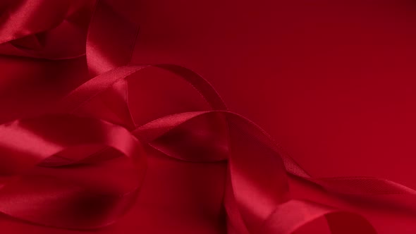 Red Rotating Background with Red Satin Ribbons