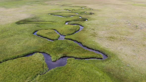 Aerial View of Green Land and Small Curve River in Aspen Springs alt