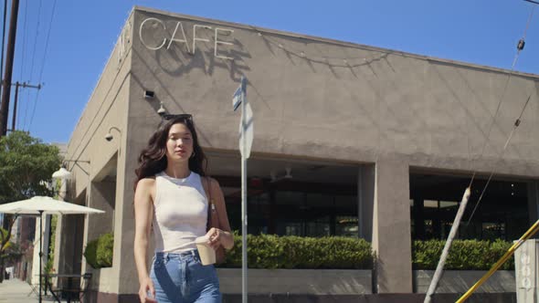 Pretty Lady Taking Coffee Cup Walking Street alt