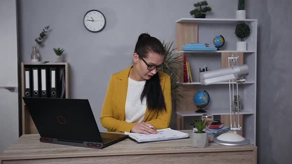 Concentrated Businesswoman in Stylish Jacket Working on Computer at Home alt
