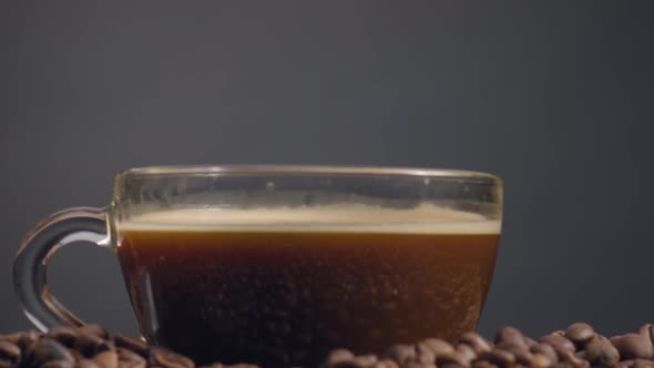 Closeup Mug Aromatic Coffee on Beans Heap alt