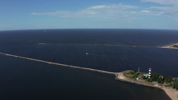 Aerial View of the Lighthouse and Mole at River Daugava in Latvia alt