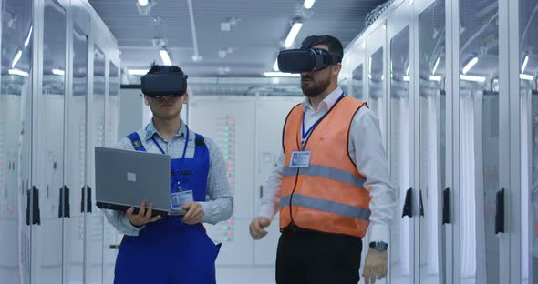 Electrical Workers in Reflective Vests Using VR Headsets alt