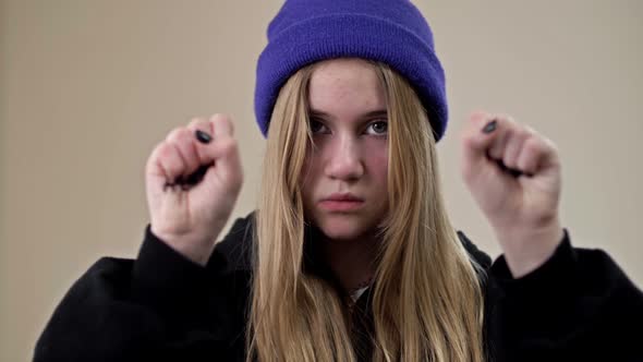 Portrait of a Frustrated Teenage Girl Showing Her Palms with the Inscription HELP ME alt