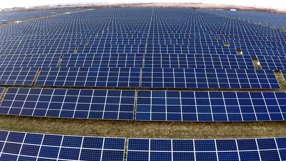 Renewable ecological source of energy from the sun. Aerial view of Solar Panels Farm. alt