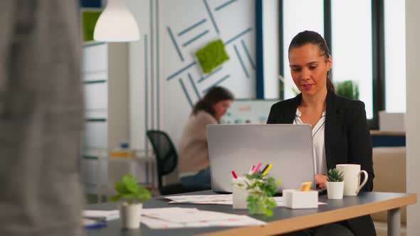 Enthusiastic Woman Manager Typing on Laptop Browsing on Internet alt