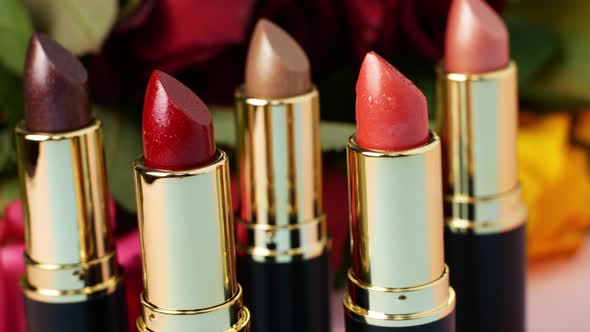 The slider of movement of lipsticks of different colors. Cosmetics for women