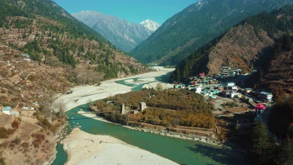 Aerial drone shot of  bridge over the Bhagirathi river flowing through sands