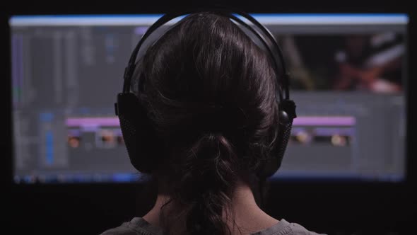 A Man Works at a Computer alt