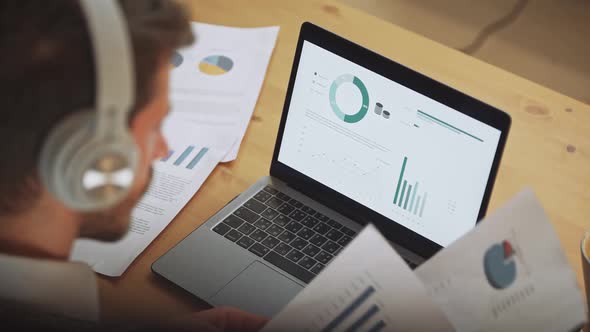 Man Manager Financial Analyst on a Remote Work at Home Working with Documents and Financial alt