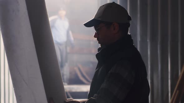 Craftsman Examining Polymer Block in Hangar alt