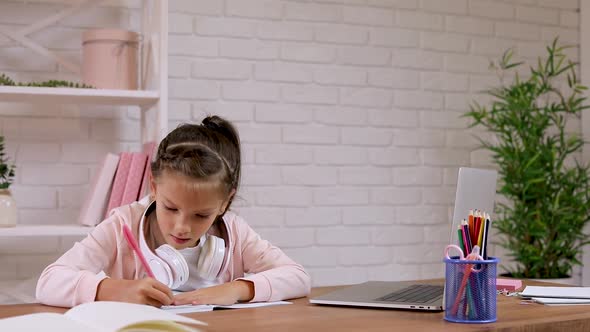 Little Child Girl Using Laptop Computer for Studying Online E-learning System