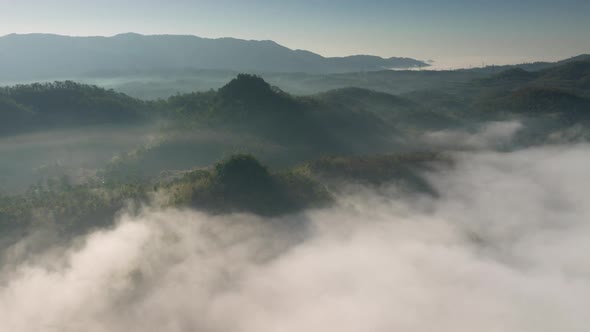 Aerial view Beautiful of morning scenery Golden light sunrise And the mist flows on high mountains.