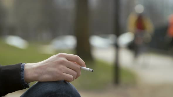 Smoker Holding Cigarette In Hand