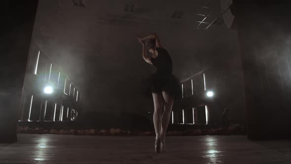 Slow Motion Prima Ballet in a Black Dress Performs Rotations and Dance Graceful Movements Rehearsing alt