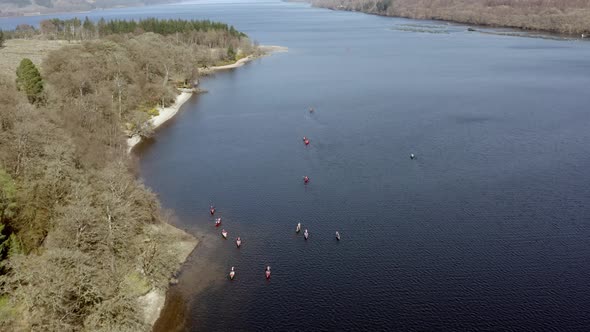 Canoeists in Scotland in a Loch Surrounded by Beautiful Landscape From the Air alt