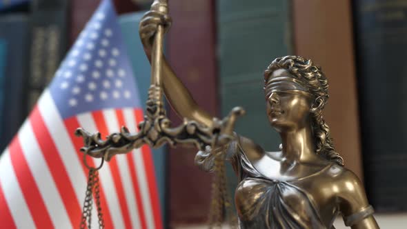 Lady Justice Symbol with USA Flag and Bookshelf Background