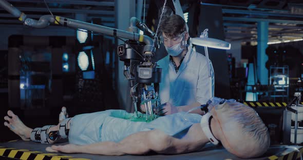 Young Scientist Does an Autopsy of a Space Alien in a Laboratory alt