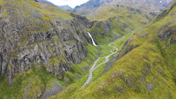Aerial view of a waterfall in Anderson Bay, Unalaska, Alaska, United States. alt