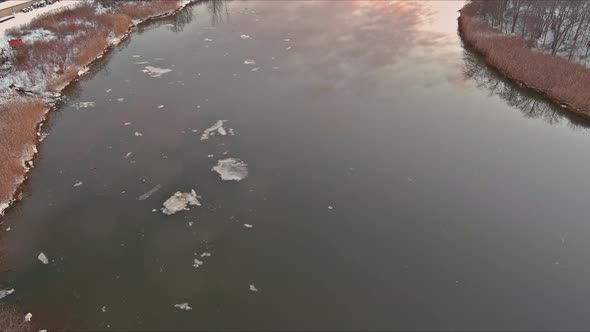 Ice Small Flows Breaking Up in the Early Spring on the River alt
