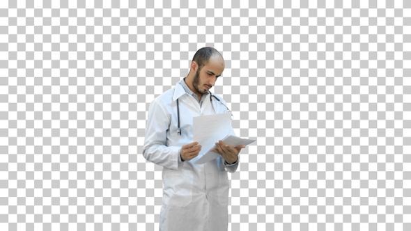 Male medicine doctor checking his papers, Alpha Channel