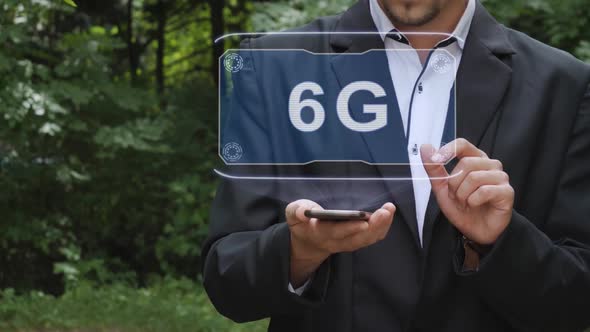 Businessman Uses Hologram with Text 6G alt