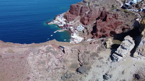 Aerial view of the  port Ammoudi below white Greek village Oia on the cliff of the Santorini Caldera alt