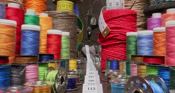 Small tailor workshop sewing traditional individual clothes. alt