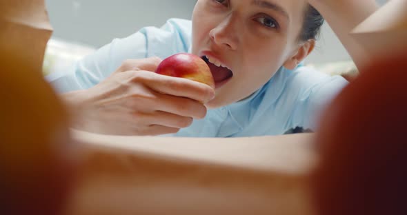 Inside View of Craft Paper Bag with Woman Taking Apple alt