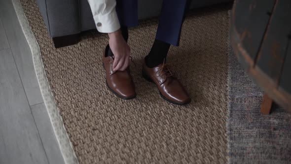 Closeup of Male Hands Tying Shoes Wedding Groom alt