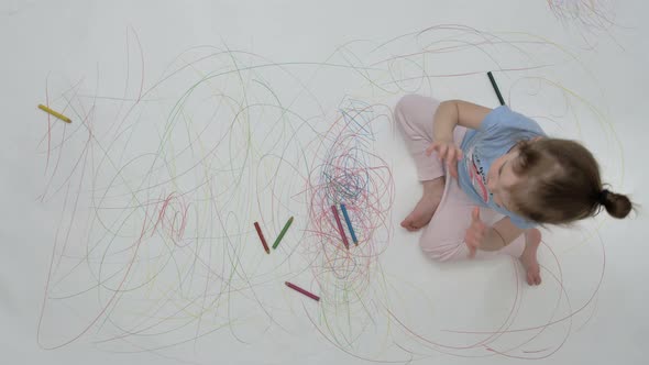 Girl Waves Hello Against the Background of the Painted Floor alt