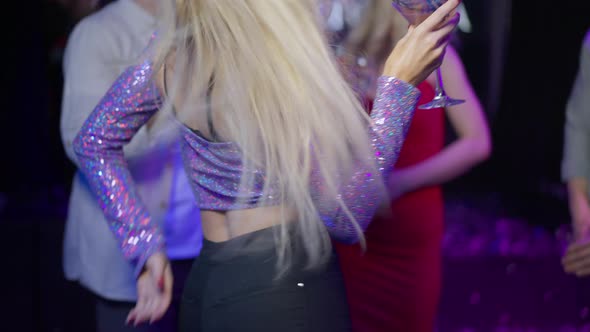 Unrecognizable Slim Young Seductive Woman Dancing in Night Club with Cocktail Glass alt