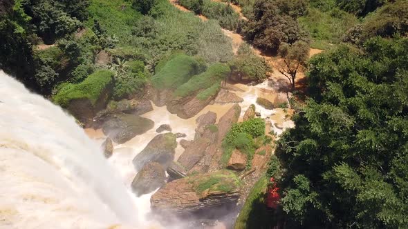 Aerial Top Down View of Massive Waterfall Cascade in the Wild Rainforest alt