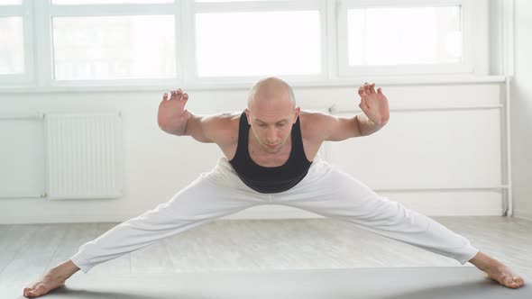 Healthy Male Stretching Doing Hard Yoga Exercises