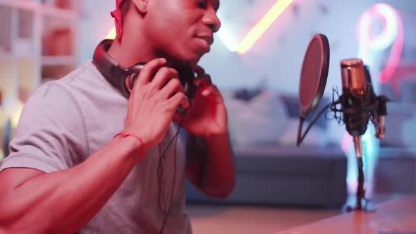 Young Black Hip-Hop Producer Recording Music in Home Studio alt