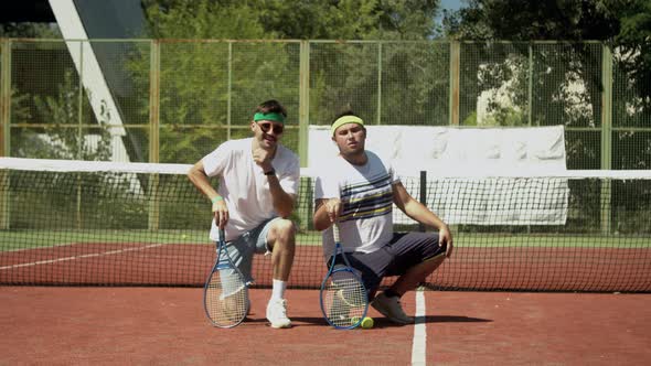 Tennis Players Posing Near Net on Court