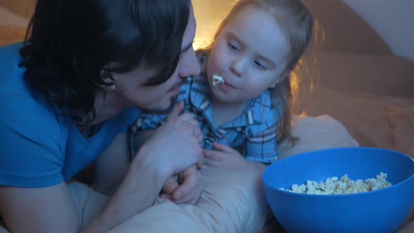 Happy Family Dad and Daughter Watch TV Eat Popcorn Love Each Other