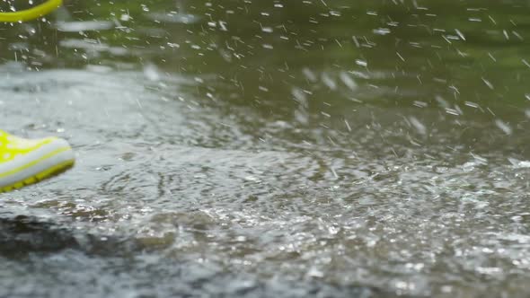 Children Running through Puddle alt