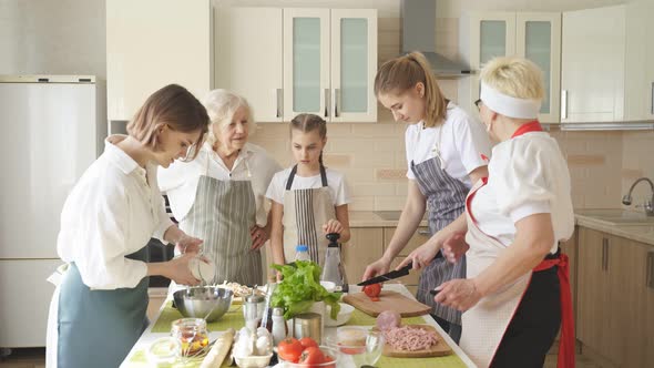 Happy Family Cooking Together on Kitchen