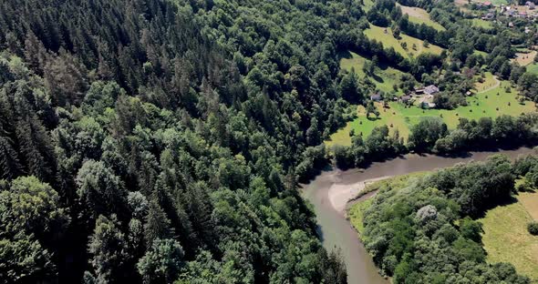Aerial View Of The Aries River Surrounded With Green Forest On Sunny Day In Romania alt