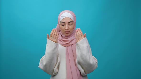 Muslim Woman in Hijab Praying Namaz Concept of Worship During Ramadan and Religious Holidays