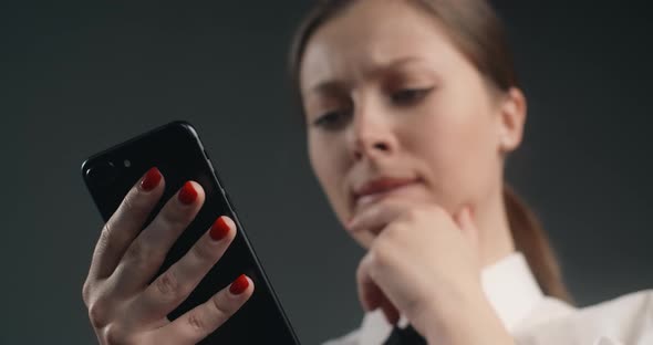 Dissatisfied European Woman Swipes the Screen of Smartphone in a Rush User Declines Meassages and alt