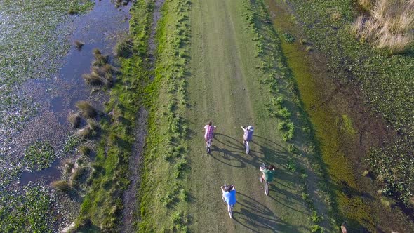 Bicycling on dirt road through Ibera Wetlands, Corrientes Province, Argentina alt