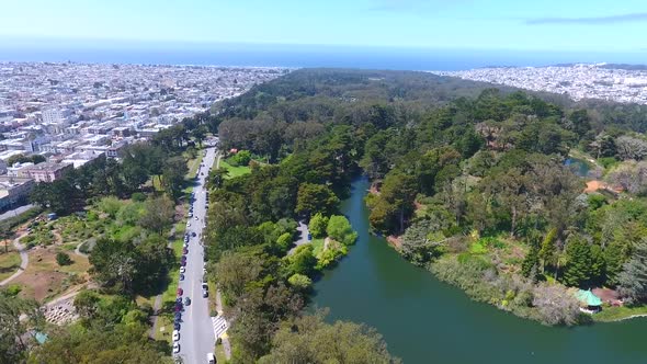 Aerial Pan Across San Francisco Golden Gate Park with City and Ocean Around alt