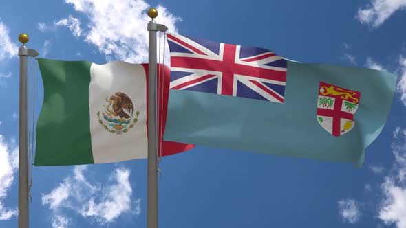 Mexico Flag Vs Fiji Flag On Flagpole alt