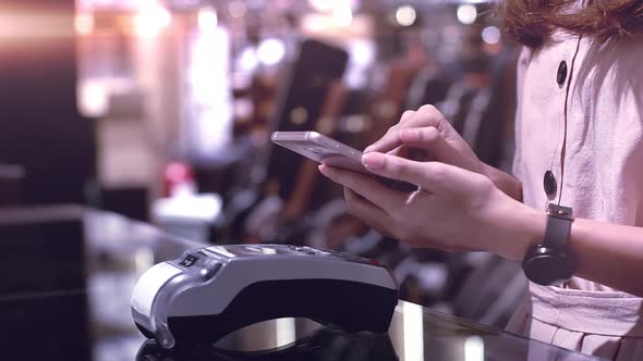 Young Asian Woman Using Mobile Phone Smart Payment 02 alt